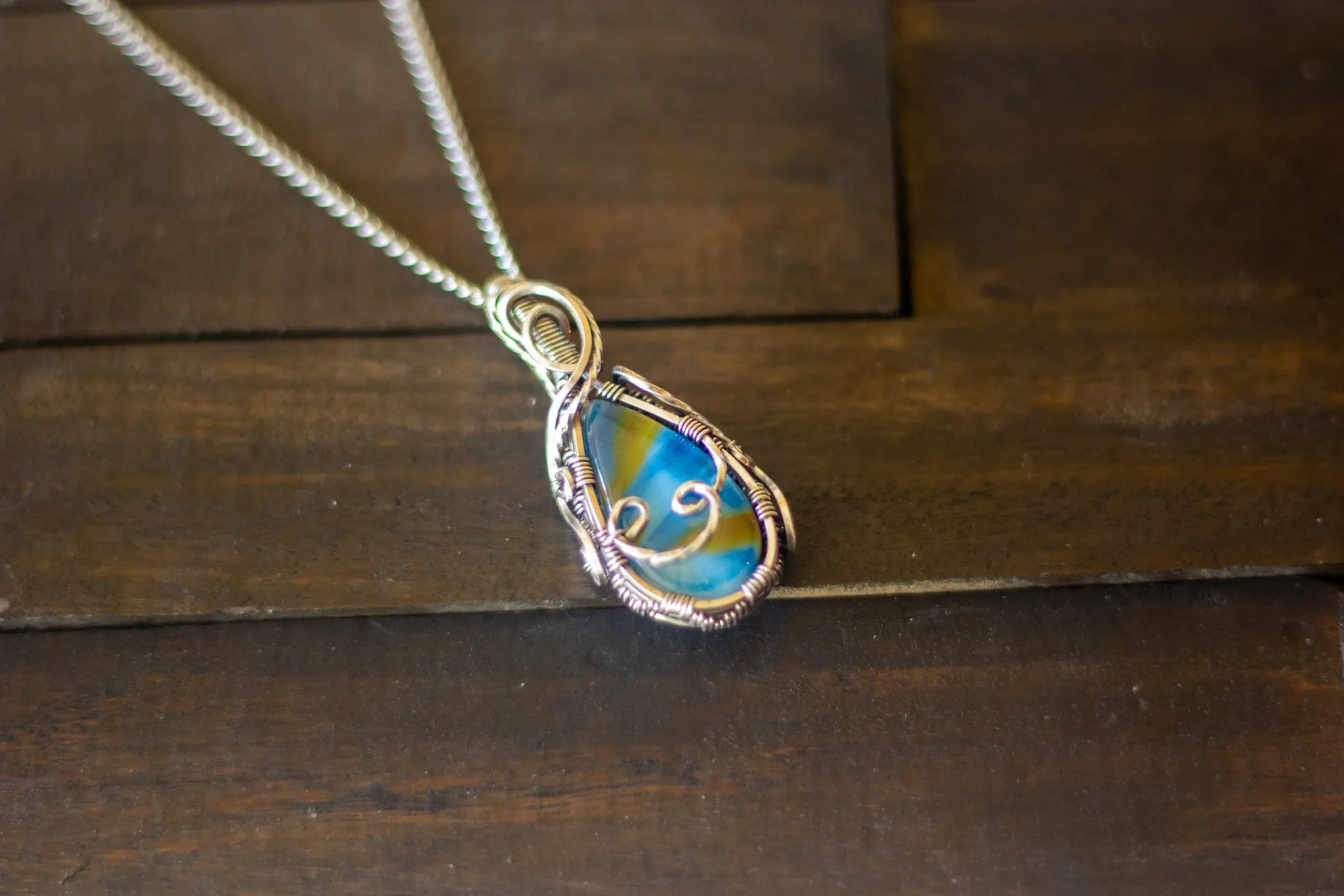 Sterling Silver Teardrop Pendant with Blue and Orange Fused Glass