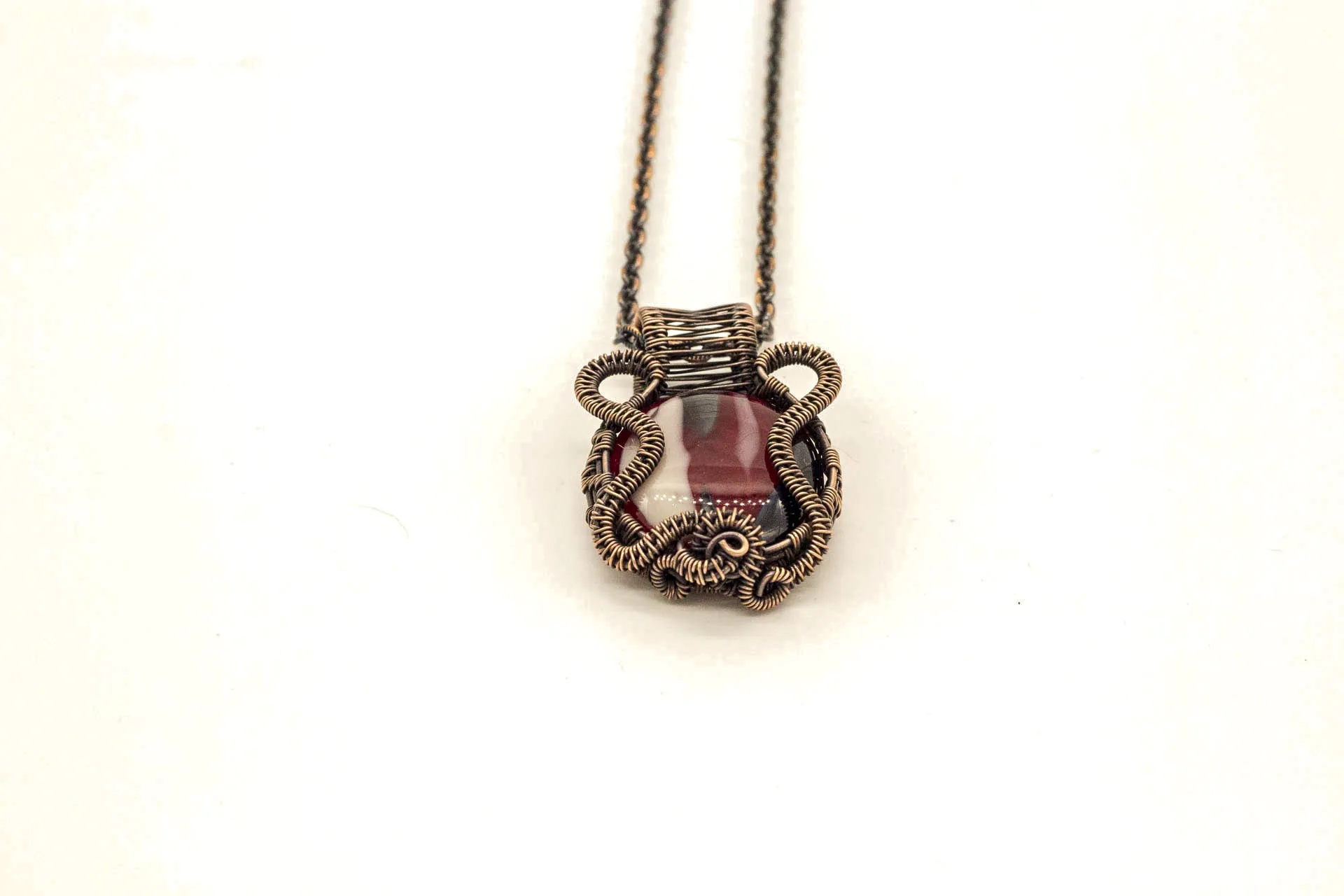 Streaked Red, Black, and White Fused Glass Pendant with Copper Wire Wrapping