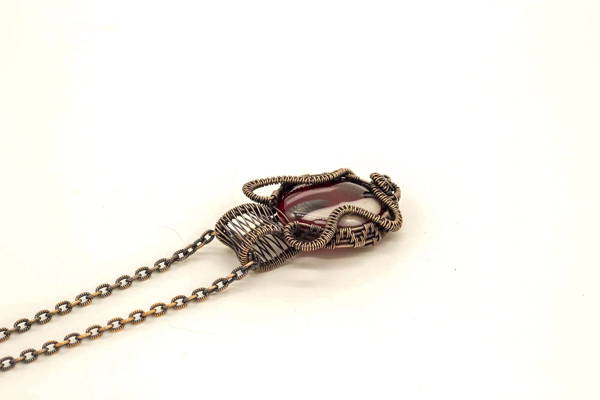 Streaked Red, Black, and White Fused Glass Pendant with Copper Wire Wrapping