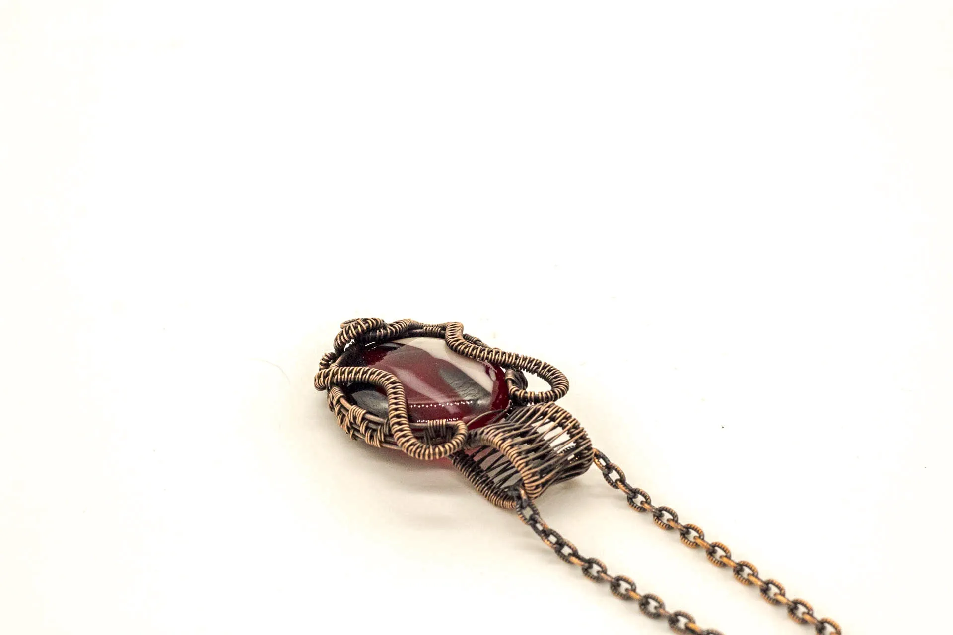 Streaked Red, Black, and White Fused Glass Pendant with Copper Wire Wrapping