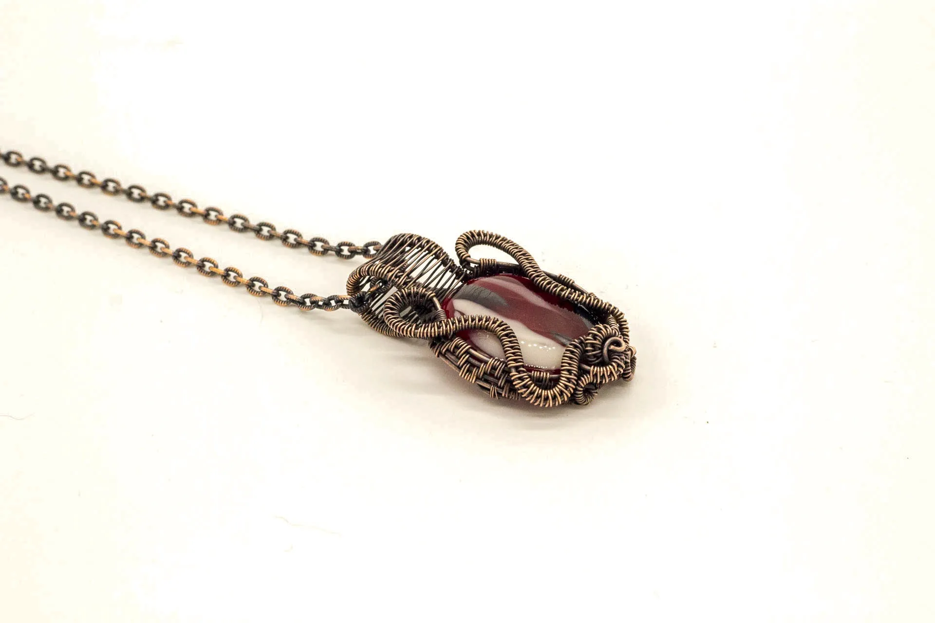 Streaked Red, Black, and White Fused Glass Pendant with Copper Wire Wrapping