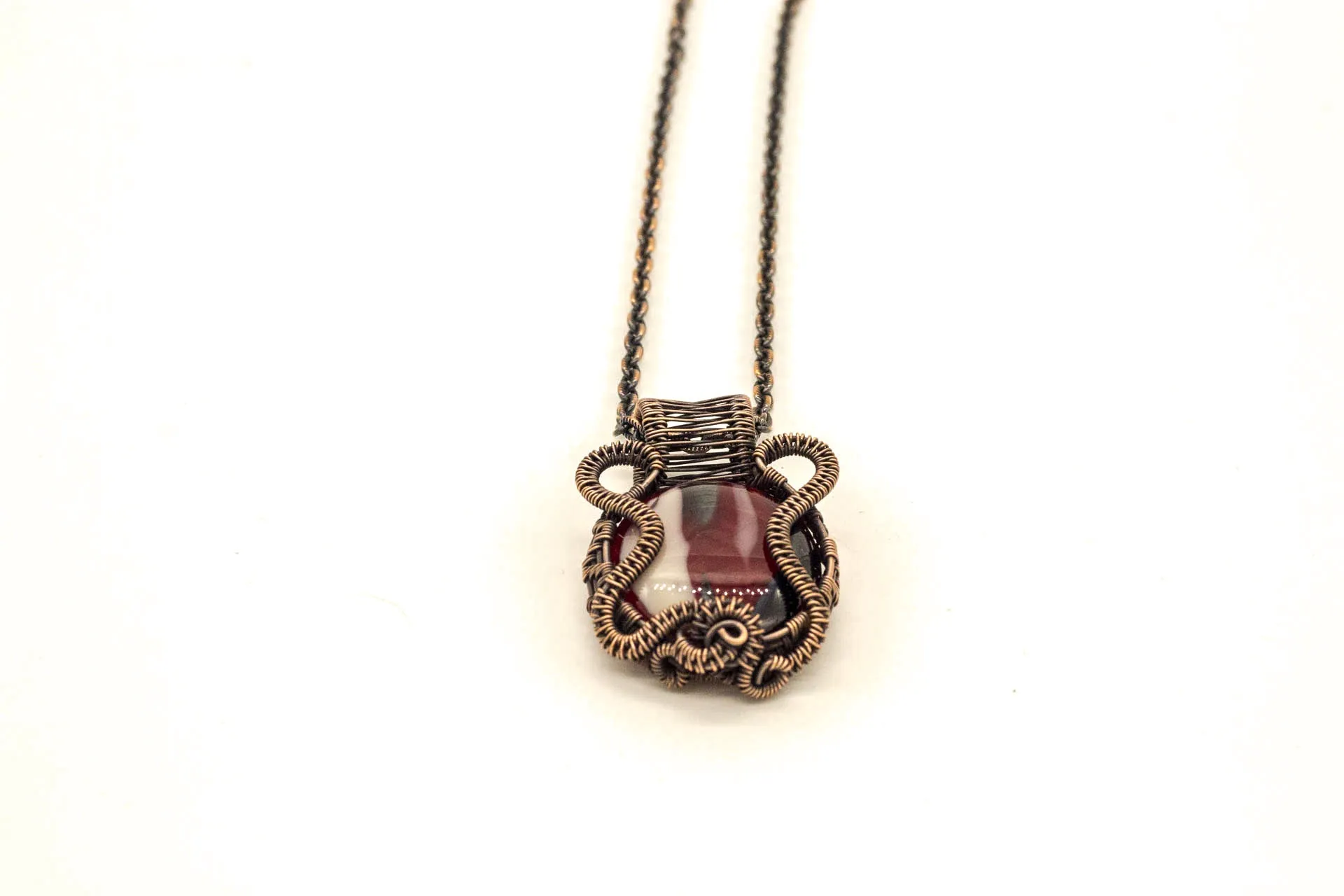 Streaked Red, Black, and White Fused Glass Pendant with Copper Wire Wrapping
